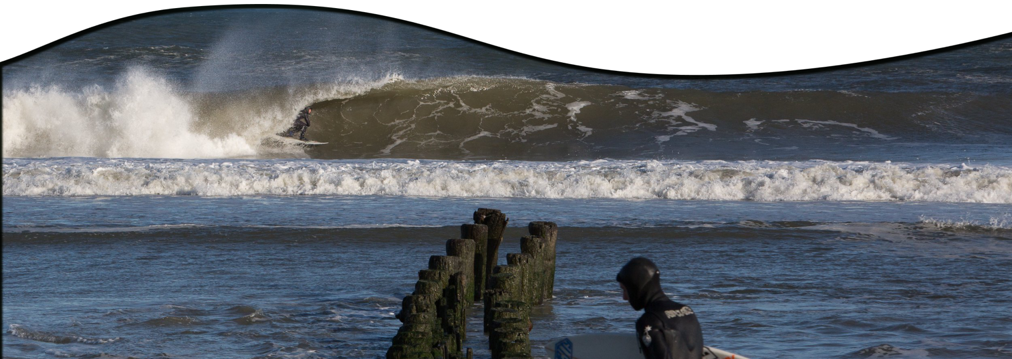 a person riding a wave on a surfboard in the water
