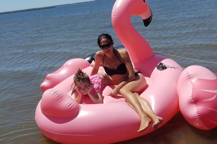 a person sitting next to a body of water