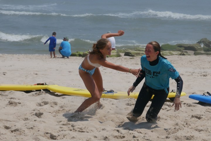 a person playing frisbee on the beach