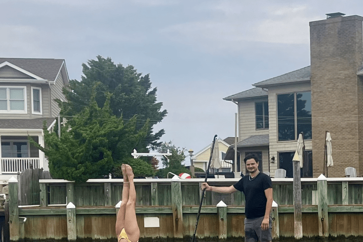 a group of people in a small boat in a body of water