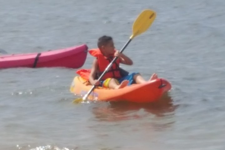 a small boat in a body of water