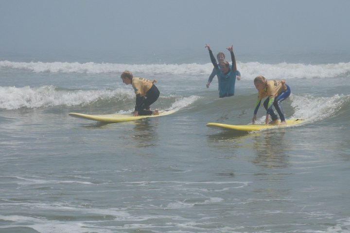 a man riding a wave on a surfboard in the ocean