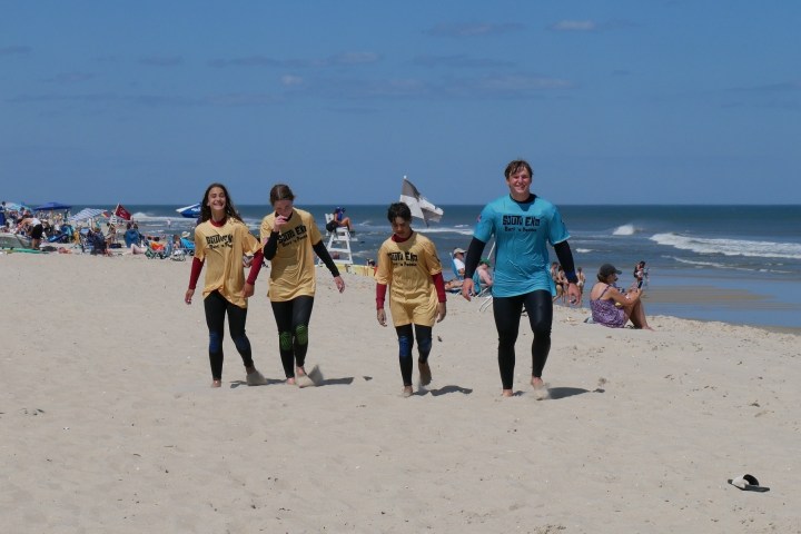 a group of people on a beach