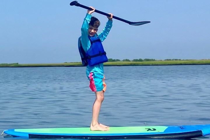 a person standing in front of a body of water