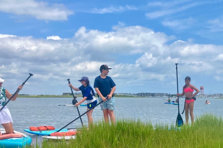 a group of people in a boat on a body of water