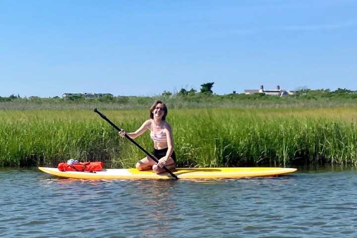 a person rowing a boat in a body of water
