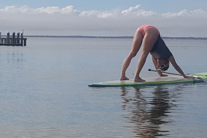 a person riding a surfboard on top of a body of water
