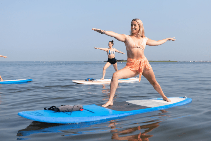 a woman riding a surfboard in the water