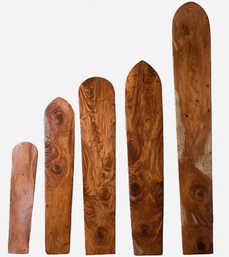 a group of shoes on a wooden surface