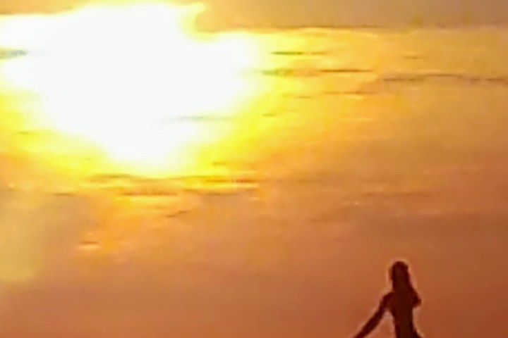 a sunset over a body of water