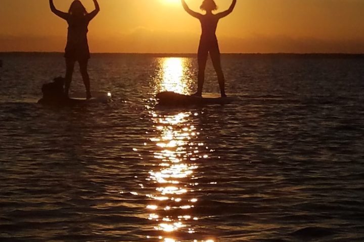 a person standing next to a body of water
