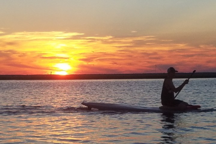 a sunset over a body of water
