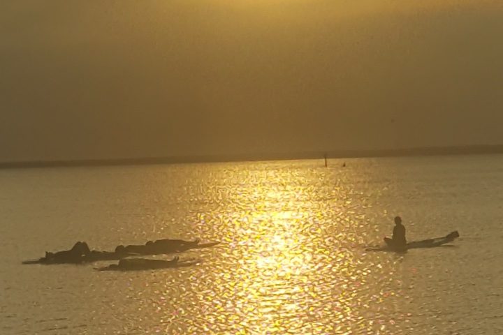 a sunset over a body of water