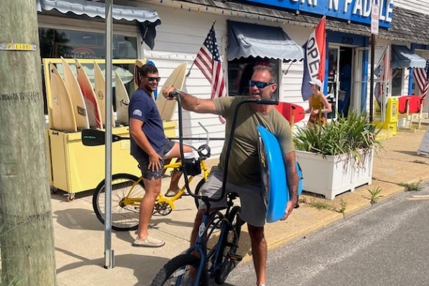 a man riding a bicycle down the street
