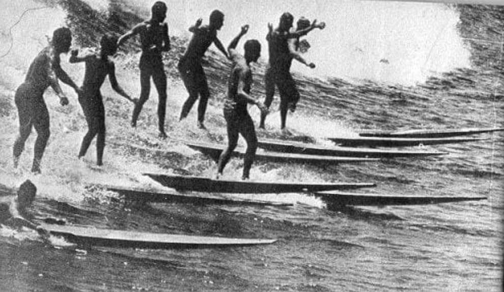 a group of people that are standing in the water