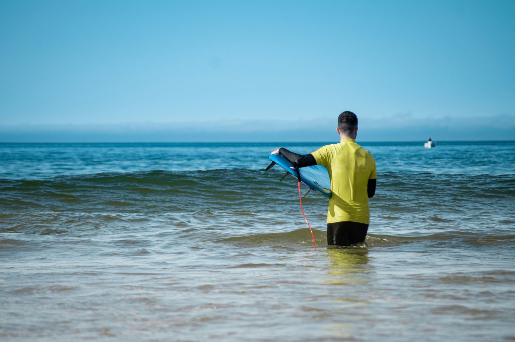 image-asset-948 a man standing next to a body of water