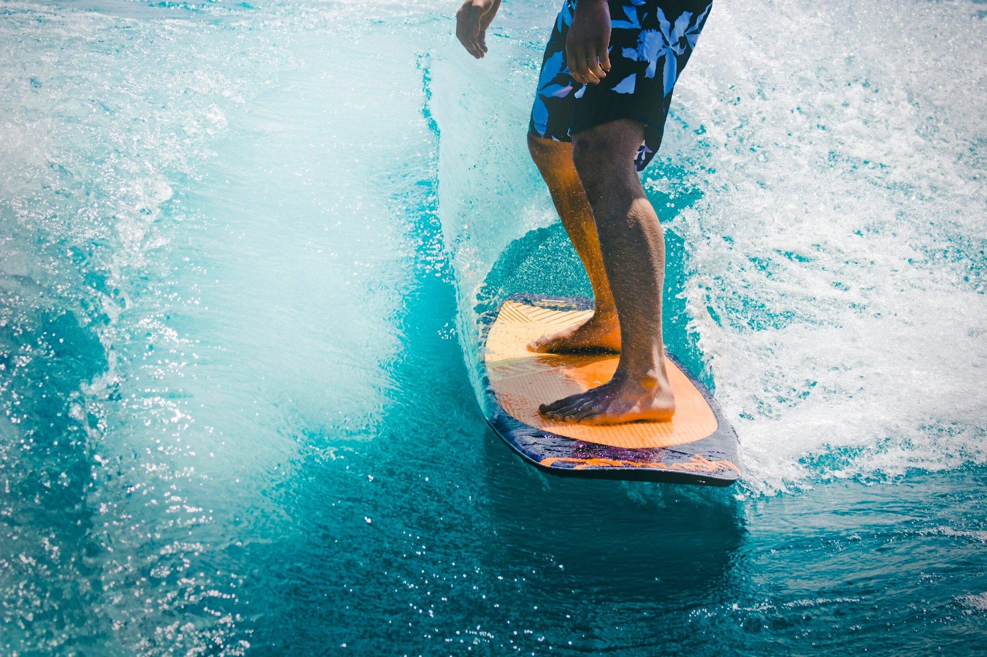 image-asset (11) a man riding a wave on a surfboard in the water